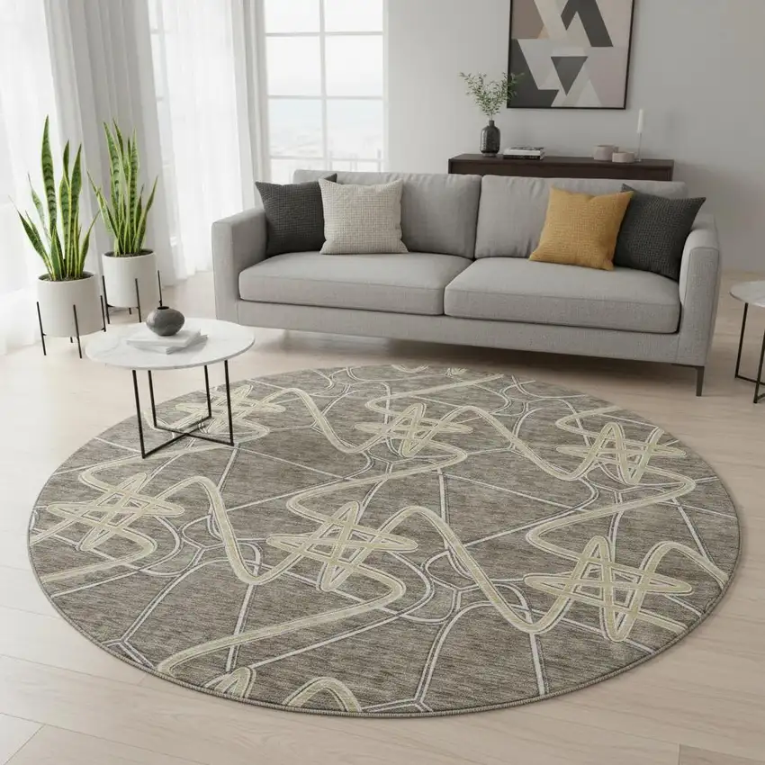 8' Taupe Gray And Gold Geometric Washable Round Rug With UV Protection Photo 2