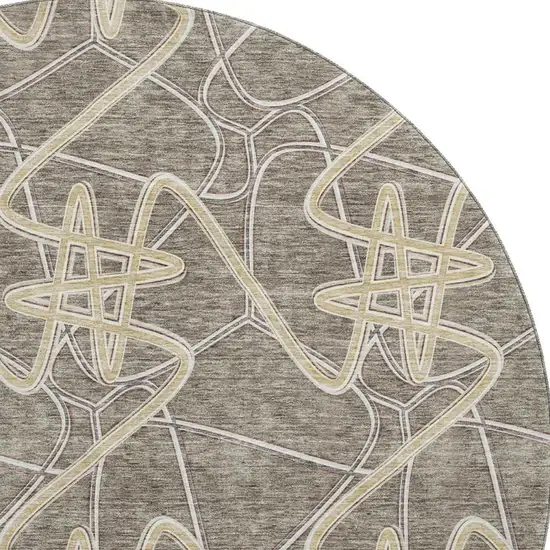8' Taupe Gray And Gold Geometric Washable Round Rug With UV Protection Photo 3