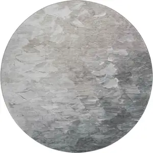 Photo of 8' Taupe Gray And Silver Abstract Washable Round Rug With UV Protection