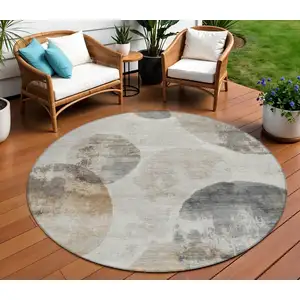 Photo of 8' Taupe Ivory And Beige Round Abstract Washable Indoor Outdoor Area Rug