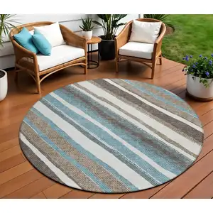 Photo of 8' Taupe Ivory And Blue Round Striped Washable Indoor Outdoor Area Rug