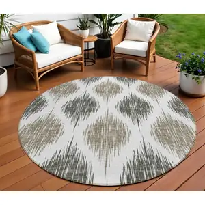 Photo of 8' Taupe Ivory And Brown Round Ikat Washable Indoor Outdoor Area Rug