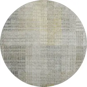Photo of 8' Taupe Ivory And Gold Abstract Geometric Washable Round Rug With UV Protection