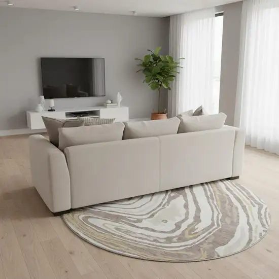 8' Taupe Ivory And Gold Abstract Washable Round Rug With UV Protection Photo 2