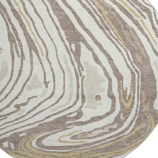8' Taupe Ivory And Gold Abstract Washable Round Rug With UV Protection Photo 2