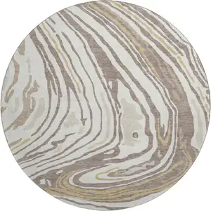 Photo of 8' Taupe Ivory And Gold Abstract Washable Round Rug With UV Protection