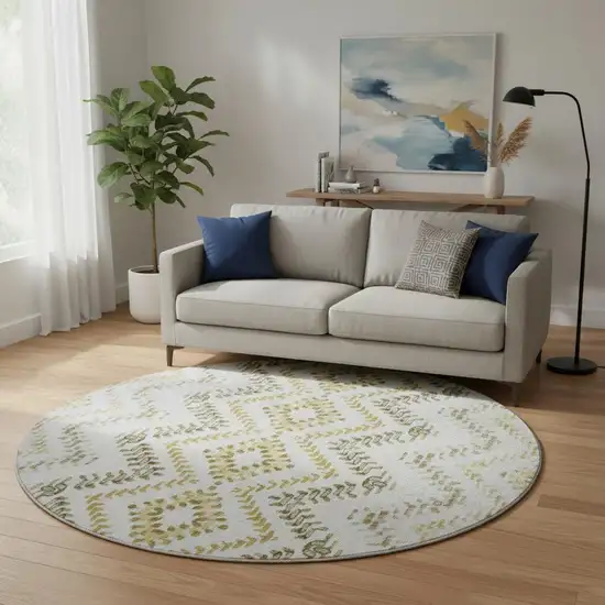 8' Taupe Ivory And Gold Geometric Washable Round Rug With UV Protection Photo 2