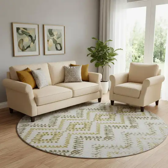 8' Taupe Ivory And Gold Geometric Washable Round Rug With UV Protection Photo 1