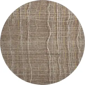 Photo of 8' Taupe Ivory And Gold Striped Washable Round Rug With UV Protection