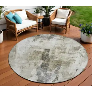Photo of 8' Taupe Ivory And Gray Round Abstract Washable Indoor Outdoor Area Rug