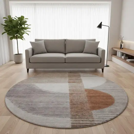 8' Taupe Ivory And Rust Geometric Washable Round Rug With UV Protection Photo 2