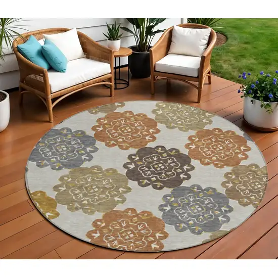 8' Taupe Orange And Ivory Round Quatrefoil Washable Indoor Outdoor Area Rug Photo 1