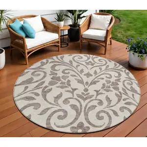 Photo of 8' Taupe Round Floral Washable Indoor Outdoor Area Rug