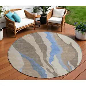 Photo of 8' Taupe Tan And Blue Round Abstract Washable Indoor Outdoor Area Rug