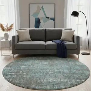 Photo of 8' Taupe Teal And Ivory Geometric Washable Round Rug With UV Protection