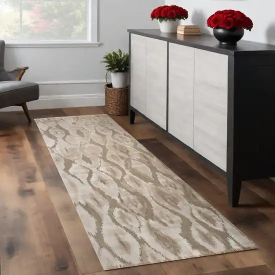 8' Taupe and Ivory Abstract Power Loom Worn Faded Runner Rug Photo 1