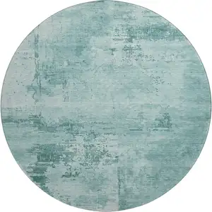 Photo of 8' Teal And Aqua Abstract Washable Round Rug With UV Protection
