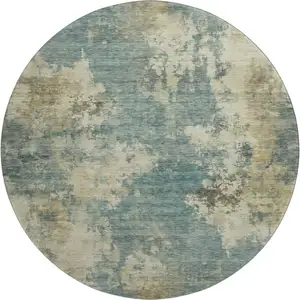 Photo of 8' Teal And Beige Abstract Washable Round Rug With UV Protection