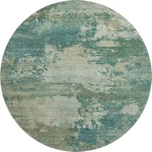 Photo of 8' Teal And Beige Abstract Washable Round Rug With UV Protection