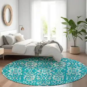 Photo of 8' Teal And Beige Floral Washable Round Rug With UV Protection