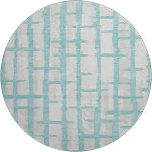 Photo of 8' Teal And Beige Striped Washable Round Rug With UV Protection
