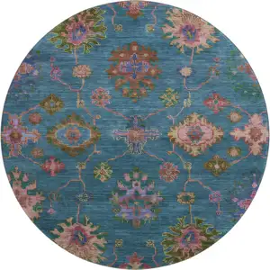 Photo of 8' Teal And Blush Oriental Washable Round Rug With UV Protection
