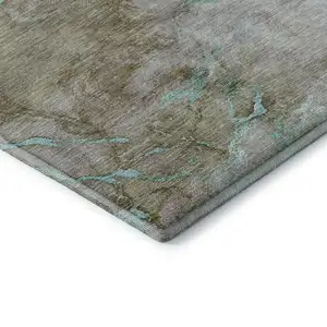 Photo of 8' Teal And Brown Abstract Washable Round Rug With UV Protection