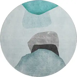 Photo of 8' Teal And Gray Abstract Washable Round Rug With UV Protection