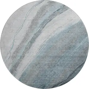 Photo of 8' Teal And Gray Abstract Washable Round Rug With UV Protection