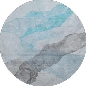 Photo of 8' Teal And Gray Abstract Washable Round Rug With UV Protection