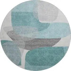 Photo of 8' Teal And Gray Abstract Washable Round Rug With UV Protection