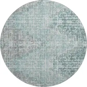 Photo of 8' Teal And Gray Geometric Washable Round Rug With UV Protection