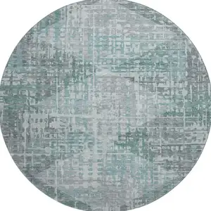 Photo of 8' Teal And Gray Geometric Washable Round Rug With UV Protection