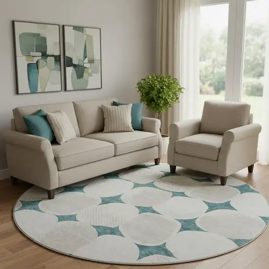 8' Teal And Ivory Abstract Geometric Washable Round Rug With UV Protection Photo 1