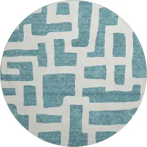 Photo of 8' Teal And Ivory Abstract Geometric Washable Round Rug With UV Protection