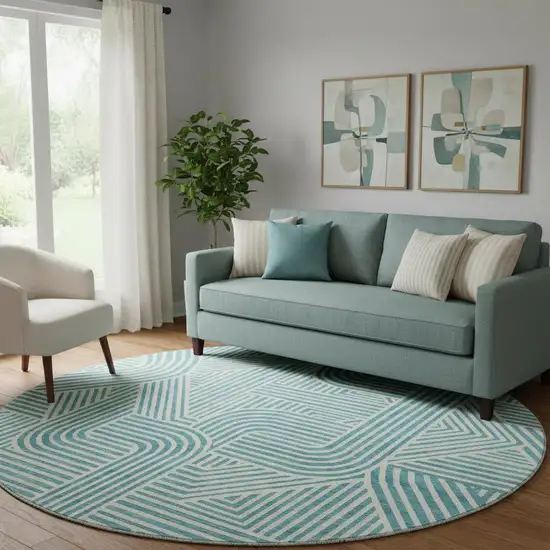 8' Teal And Ivory Abstract Geometric Washable Round Rug With UV Protection Photo 1