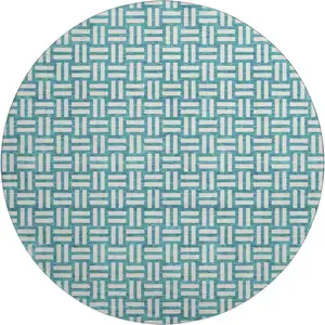 Photo of 8' Teal And Ivory Abstract Geometric Washable Round Rug With UV Protection