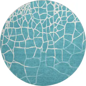 Photo of 8' Teal And Ivory Abstract Geometric Washable Round Rug With UV Protection
