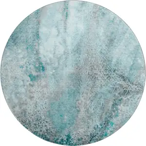 Photo of 8' Teal And Ivory Abstract Washable Round Rug With UV Protection