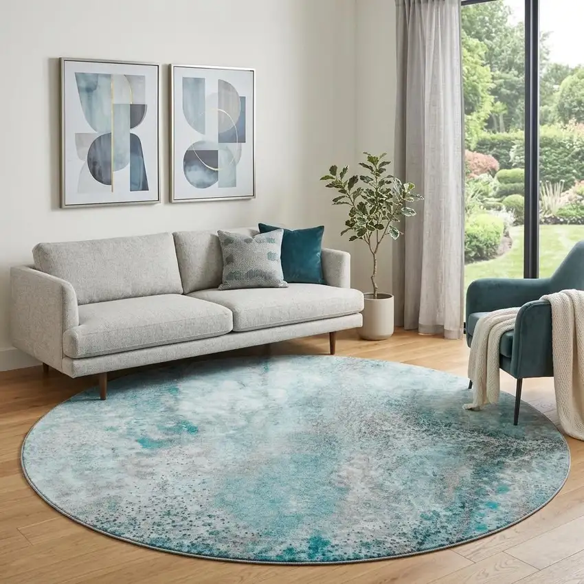 8' Teal And Ivory Abstract Washable Round Rug With UV Protection Photo 1