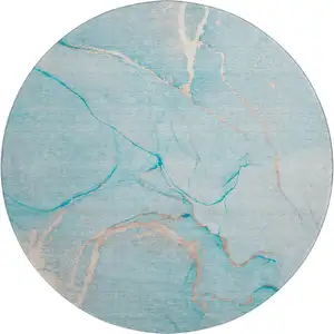 Photo of 8' Teal And Ivory Abstract Washable Round Rug With UV Protection
