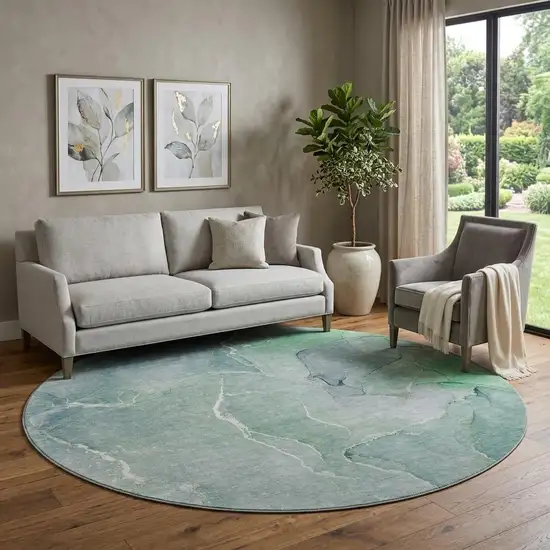 8' Teal And Ivory Abstract Washable Round Rug With UV Protection Photo 1