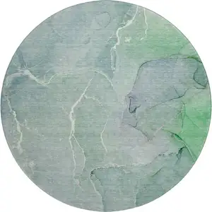Photo of 8' Teal And Ivory Abstract Washable Round Rug With UV Protection