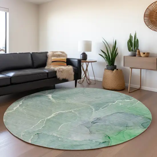 8' Teal And Ivory Abstract Washable Round Rug With UV Protection Photo 5