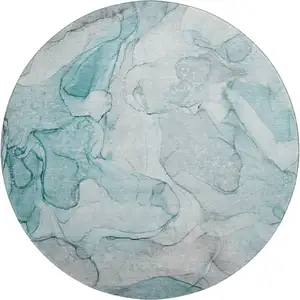 Photo of 8' Teal And Ivory Abstract Washable Round Rug With UV Protection