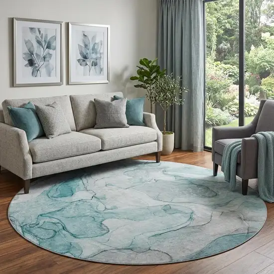 8' Teal And Ivory Abstract Washable Round Rug With UV Protection Photo 1