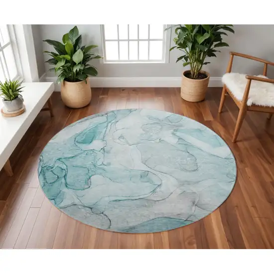 8' Teal And Ivory Abstract Washable Round Rug With UV Protection Photo 2