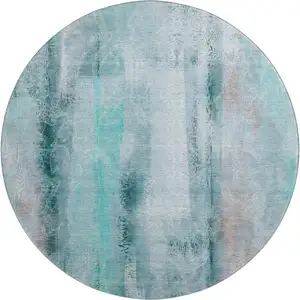 Photo of 8' Teal And Ivory Abstract Washable Round Rug With UV Protection