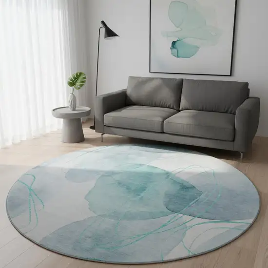 8' Teal And Ivory Abstract Washable Round Rug With UV Protection Photo 2