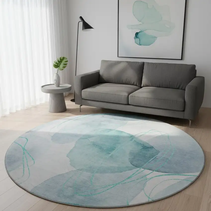 8' Teal And Ivory Abstract Washable Round Rug With UV Protection Photo 2